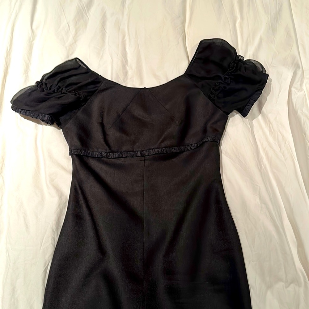 Versace black silk and wool cocktail dress with capped sheer sleeves. Size 8